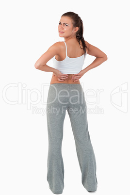 Back view of woman with backache