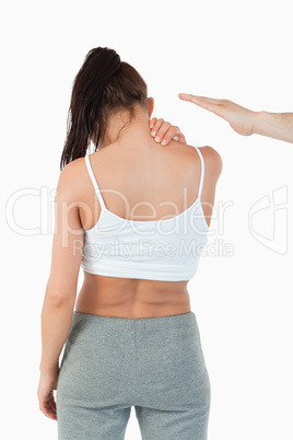 Back view of woman having neck pain