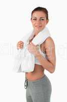 Side view of sportswoman with towel around her neck