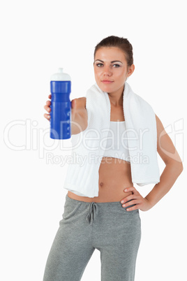 Atletic young woman offering a sip of water