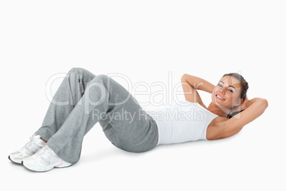 Young woman doing sit ups