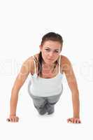 Atletic female doing push ups