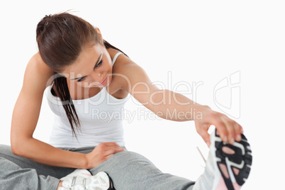 Young woman doing stretches