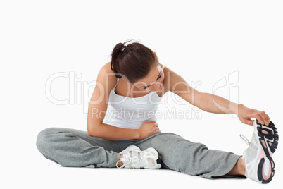 Young woman warming up before training