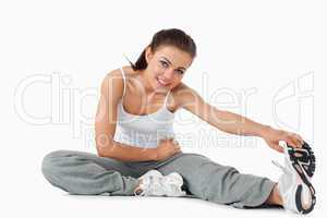 Young woman warming up before workout