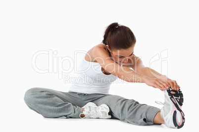 Young female warming up before training