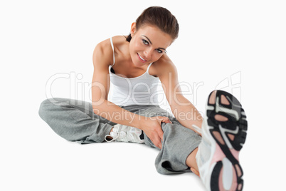 Young woman getting warmed up before workout