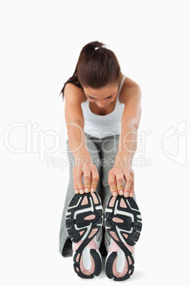Young woman getting warmed up before training
