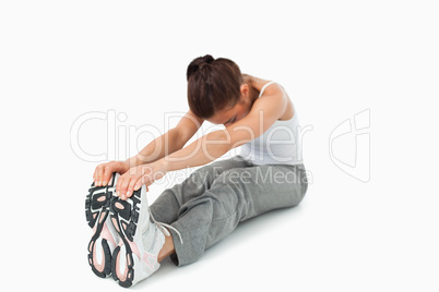 Young woman stretching before workout