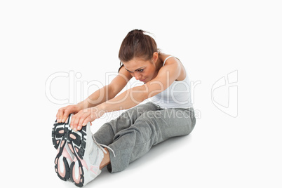 Young female doing stretches before workout