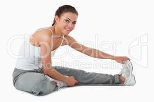 Side view of stretching woman
