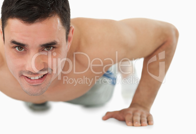 Young male doing push ups