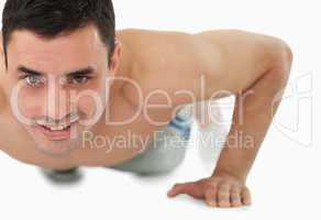 Young male doing push ups