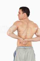 Young male experiencing back pain