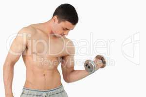 Young male lifting weight