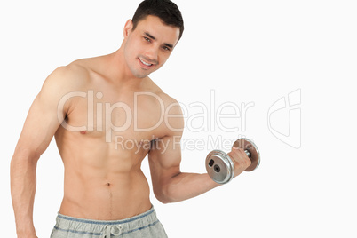 Young man lifting weight