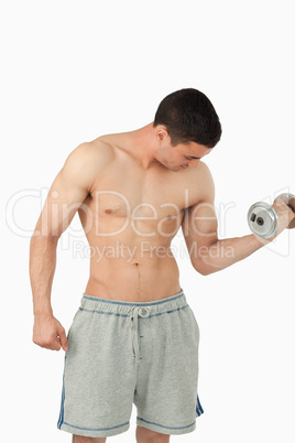 Young male doing weight lifting