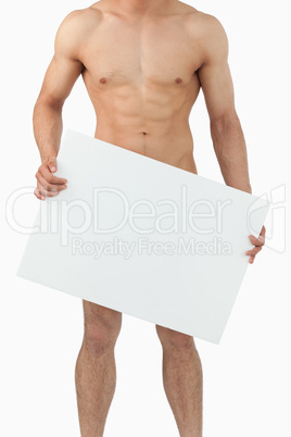 Atletic male body holding banner