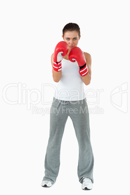 Female boxer taking cover