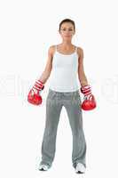 Atletic female with boxing gloves on