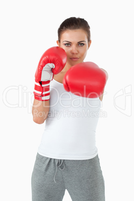 Young female boxer striking with her left