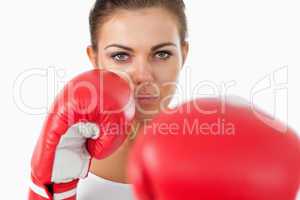 Female boxer attacking with her left