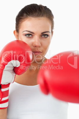 Female boxer hitting with her left
