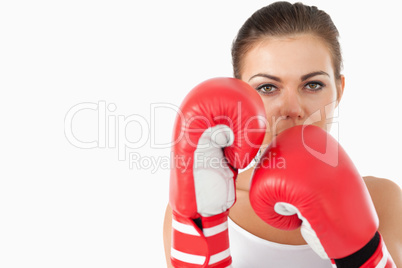 Female boxer taking cover behind her fists