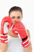 Female boxer behind cover