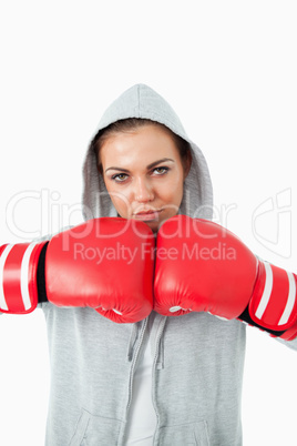 Young female boxer wearing hoodie sweater
