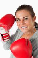 Portrait of a smiling woman with boxing gloves