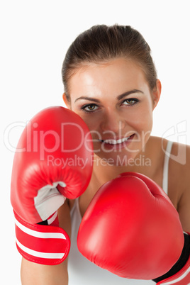 Portrait of a beautiful woman with boxing gloves