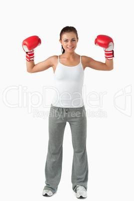 Portrait of a smiling female boxer standing up