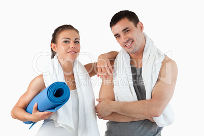 Fit couple going to practice yoga