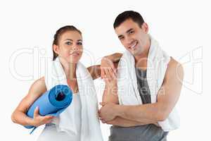 Fit couple going to practice yoga