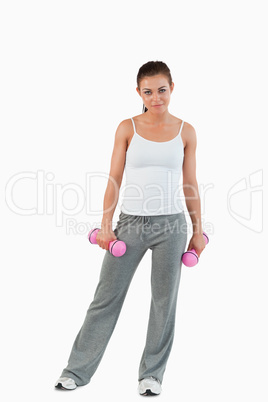 Portrait of a woman with dumbbells