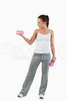 Portrait of a woman working out with dumbbells