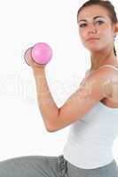 Close up of a woman working out with dumbbells