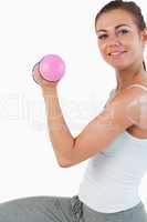 Close up of a fit woman working out with dumbbells