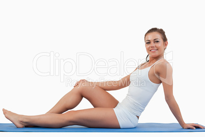 Woman lying on a foam mat