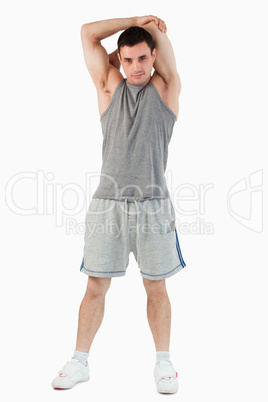 Portrait of a man stretching his arm