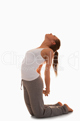 Portrait of a woman in the Ustrasana position