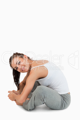 Portrait of a fit woman stretching her legs