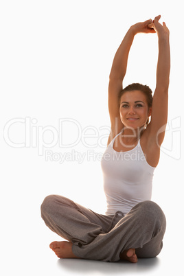 Portrait of a fit woman stretching her back