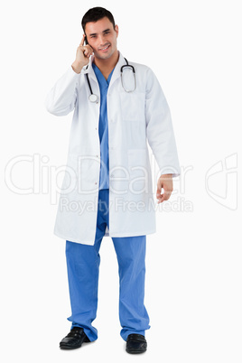 Portrait of a doctor making a phone call