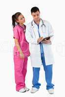 Portrait of a doctor and a nurse taking notes