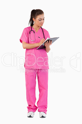 Portrait of a female doctor writing Portrait of a female doctor writing