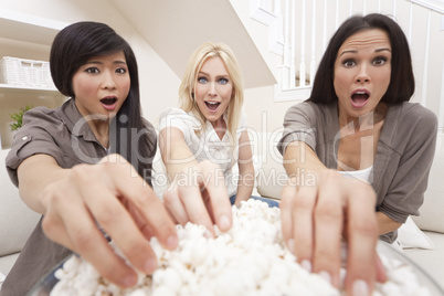 Three Beautiful Women Friends Eating Popcorn Watching Movie at H