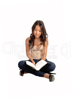 Girl sitting  and reading.