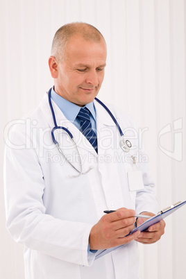 Mature doctor male portrait write document